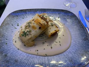 Talo relleno de verduras con chorizo vegano y salsa de queso.  at La Parada de Bilbao in Bilbao