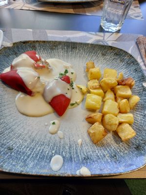 Pimientos rellenos de verdura con salsa de queso vegano at La Parada de Bilbao in Bilbao