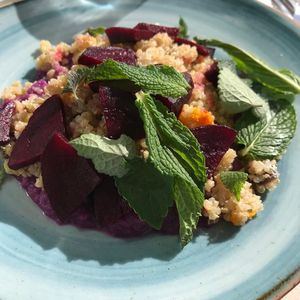 Vegan beets and quinoa salad on a bed of red cabbage purée  at kuten inclusive kitchen in North Miami Beach