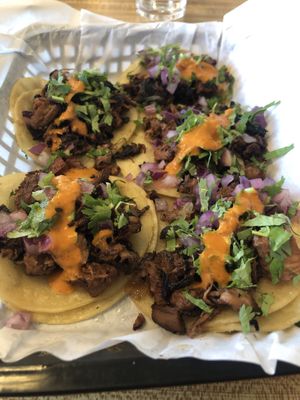Bomb jackfruit tacos on a taco Tuesday where you get one free.  at Just Vegana in Fontana