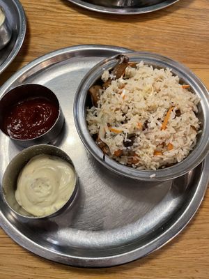 Mushrooms onions and fried rice dish  at Saravanaa Bhavan - Sankt Eriksgatan in Stockholm