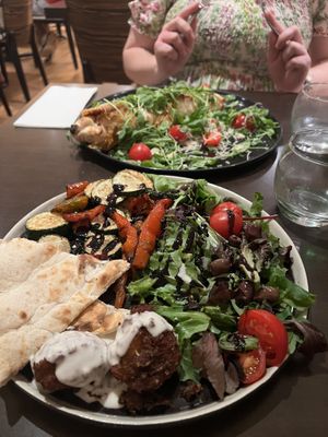 The Stromboli (back) and a veg, meatball, focaccia and salad plate (front)  at Utopia in Nice