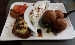 A welcome surprise: an amuse bouche of mini toasts and "accras," deep fried balls of goodness with a creamy dipping sauce. at Utopia in Nice