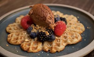 Waffle with summer berries & nut cream  at ubat veggie in Aalborg