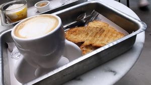 Café com leite, torrada com manteiga de coco e iogurte com granola  at Astronauta in Sao Paulo