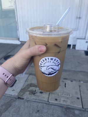 An oat milk latte with their house made lavender syrup  at Heartwork Coffee Bar in San Diego