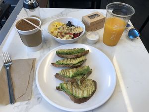 Avocado Herb Toast, Fruit Bowl, Coffee with Almond Milk and Peanut Cookies at Fruitive - Conn Ave in Washington