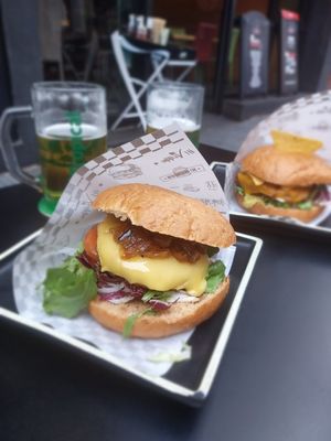 Vegan burger with caramalized onion and cheese and one mexican burger in back with Beyond burger at H Burger in Gran Canaria