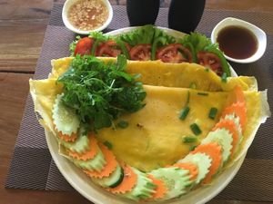 Vegan Traditional Kymer style pancake with vegetables and lemongrass and sweet kymer dipping sauces at Papa's  in Kampot