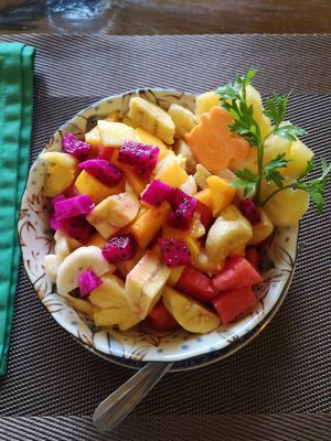fruit salad (served with a massive variety of syrups you can add yourself) at Papa's  in Kampot