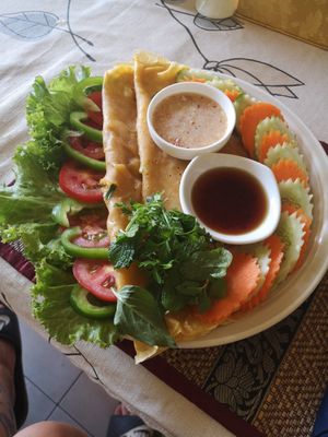 nam banj tja'o pancake with veggies and dipping sauces. at Papa's  in Kampot