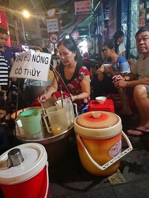 Vendor serving hot tofu at Hot Tofu - Food Stand in Ho Chi Minh City