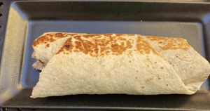 One bite I to the breakfast burrito with tofu scramble, veggie sausage, and no cheese. at The Hummingbird Cafe in Butte