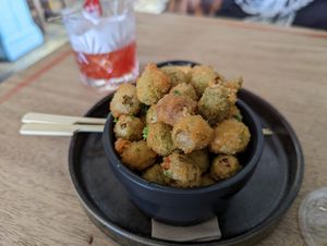 Panko olives with aioli and cherry bakewell cocktail at The Roundhill in Brighton
