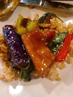 Close up of the same dish plated over brown rice at Unit Su Vege in Philadelphia