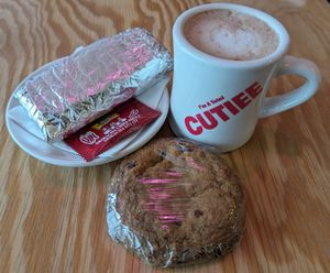 breakfast burrito, hot cocoa, and Tipping the Scales Vegan Bakery chocolate chip cookie at Coffee Beer in Portland