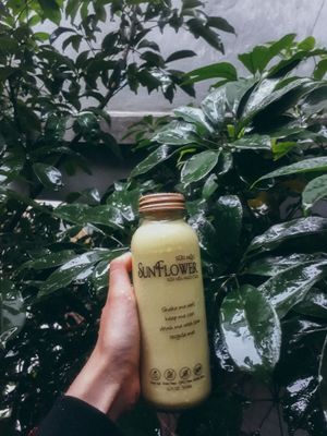 A bottle of Sunflower Nutmilk - fresh oatmilk with tumeric and cinnamon,

You can bring this bottle home - cold, or order a hot cup, sit back and enjoy at the store, at Sua Moc Nutmilk in Hanoi