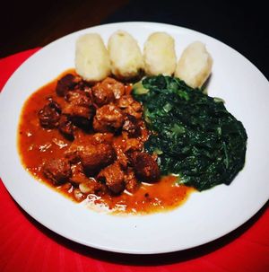 Soja na česneku s chlupatejma knedlíkama a špenátem at Bubu's Pub & Kitchen in Prague