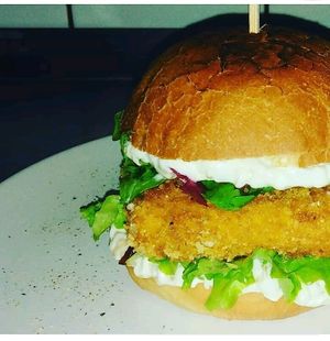 Deep-fried cheese in bun with caramelized onion and salad. Love. at Bubu's Pub & Kitchen in Prague