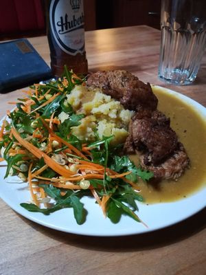 Soymeat steaks with mashed potatoes, salad and gravy at Bubu's Pub & Kitchen in Prague