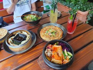 Japchae bowl, mandu, pancake, bibimbap with tofu and yellow and red lemonade. at Feel Seoul Good in Berlin