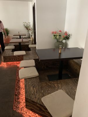 Beautiful table arrangements inside and pleasant seats outdoor  at Feel Seoul Good in Berlin