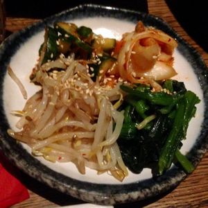 Side dishes that were served to the BBQ: Kimchi, marinated cucumbers, soy sprouts and spinach. at Feel Seoul Good in Berlin