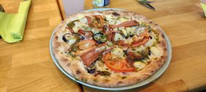 Vegan pizza with eggplant, yams, vegan mozzarella, and vegan bacon at Happiz - Monge in Paris
