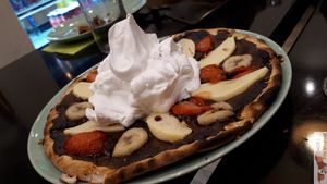 Pizza dessert with hand made chantilly, delicious at Happiz - Monge in Paris