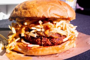Burger Battle Competitor with Miami’s famous Cuban Frita Burger
Chorizo Patty, grilled onions, potato sticks and pink sauce served on a vegan sesame brioche bun.  at Vegan Junkie - Tavern Flower Food Truck in Fort Lauderdale