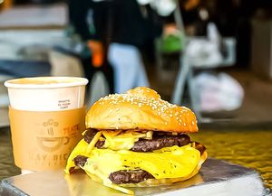 The AM Breakfast Sandwich 
Superfood Italian Sausage BF Patty, Omelette, Cafe con Leche Drizzle, Potato Sticks at Vegan Junkie - Tavern Flower Food Truck in Fort Lauderdale