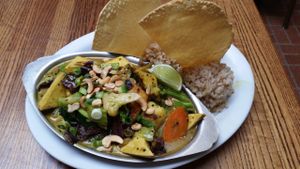 Indian Curry Plate
Organic tofu and veggies in a mild curry sauce, served with a side of rice, cashews, papadam, fruit chutney and raita

My friend ordered this. While pretty, she thought it was kind of bland which isn't what you expect with a cur at Dharma's in Capitola