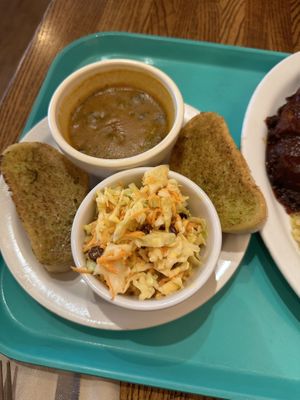 Gravy, garlic bread, and carrot salad  at Dharma's in Capitola