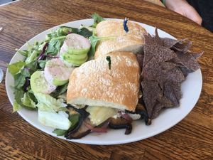 Portobello and artichoke sandwich with vegan cheese  at Dharma's in Capitola