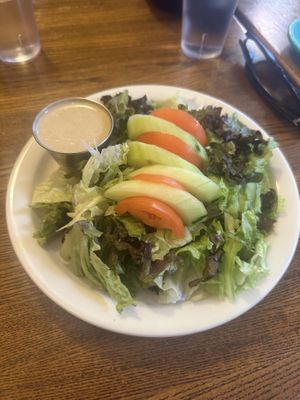 Side salad with vegan tahini lemon dressingg  at Dharma's in Capitola