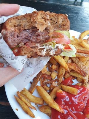 GF bun burger with fries at Yoyo Foodworld in Berlin
