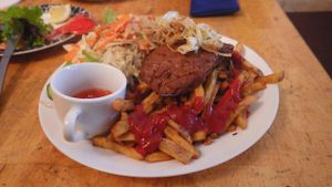 Steak burger and chips with salad at Yoyo Foodworld in Berlin