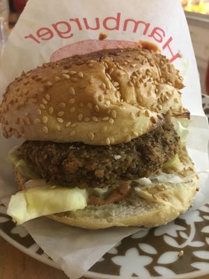 Homemade burger - lentil patty and peanut sauce at Yoyo Foodworld in Berlin