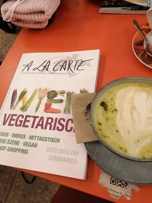 Matcha latte and vegetarian book at Plain in Vienna