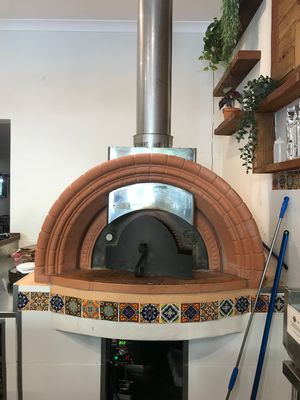 wood fire pizza oven that makes THE best pizzas  at Golden Grapes in Glebe
