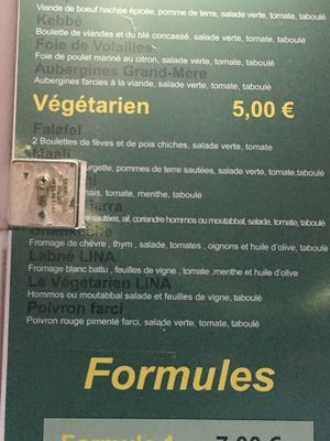 Vegetarian menu on front door at Lina Restaurant in Paris