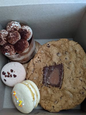 Two macarons, tiramisu and giant chocolate-chip cookie at Pastel & Coco in Gatineau