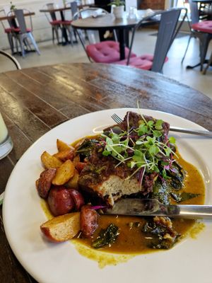 Southern Style Tofu. Crispy seasoned tofu, collard greens, baby Road potatoes, sweet garlic and ginger sauce at The Stand Vegan Cafe in Fairfield