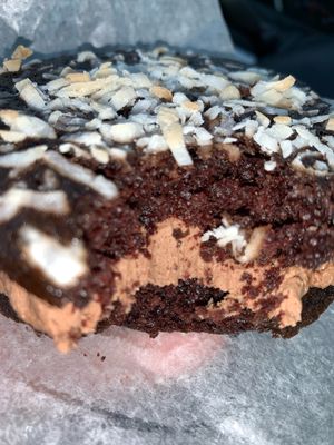 Inside of the chocolate coconut. Tastes like brownies with a thick filling at Shuga Pie Shop in Babylon