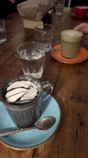 Oat milk charcoal latte and matcha latte at The Canteen in Nailsworth