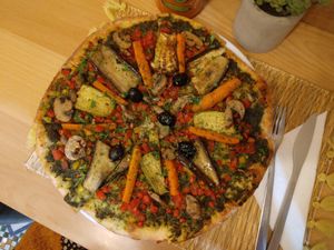 One of the best vegan pizzas I've ever had. The base is a light and simple basil, garlic and coriander pesto. Delicious 😋 at Veggie Pause  in Fes