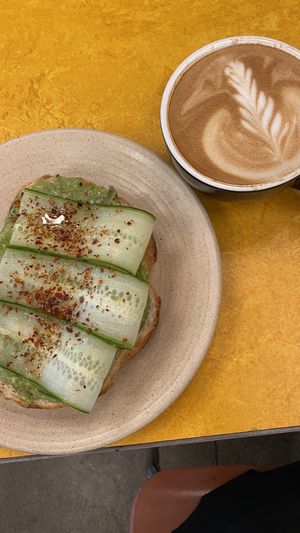 Avocado toast with oat latte  at Avalon - Woodward Ave in Detroit