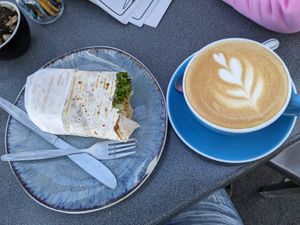 Vegan falafel wrap and almond milk flat white. at Astro Cafe in Lake Tekapo