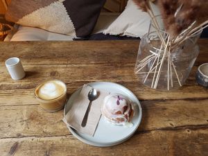 Flat white with oat milk and Cinnamon Roll at WAVE in East London