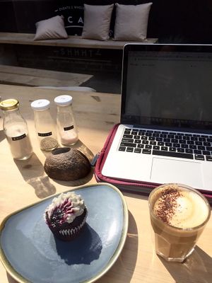 Blueberry cupcake and cappuccino on the patio. Perfect place to do work while enjoying a nice treat! at WAVE in East London
